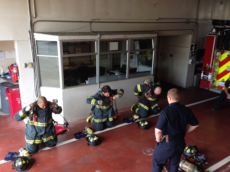 Firefighter recruits doing equipment drills